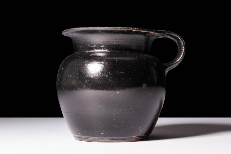 ATTIC BLACK GLAZED JUG

 Ca. 450 - 400 BC A Greek pottery jug adorned with glo...