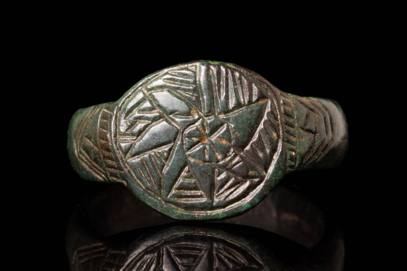 MEDIEVAL BRONZE RING DEPICTING A FLOWER

 Ca. AD 900 - 1300 A Medieval bronze ...