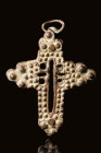 ETHIOPIAN BRONZE RELIQUARY CROSS

 Ca. AD 1600 - 1800 An Ethiopian bronze reliquary cross pendant, decorated with an open work cross in the centre. ...