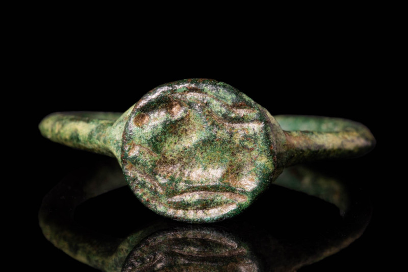 MEROVINGIAN BRONZE RING WITH RUNNING STAG

 Ca. AD 400 - 700 A Merovingian bro...