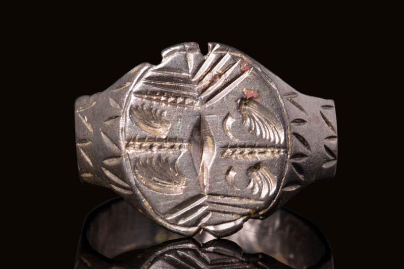 LATE MEDIEVAL SILVER RING DEPICTING FOUR STYLISED ANGELS

 Ca. AD 900 - 1200 A...