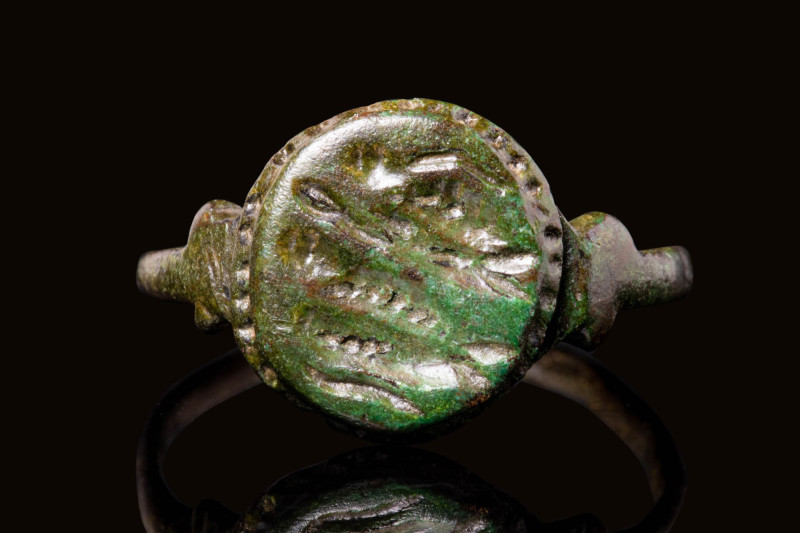 EARLY MEDIEVAL BRONZE RING WITH ANGEL

 Ca. AD 400 - 600 An early medieval bro...