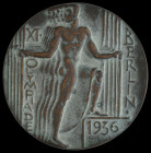 Germany, Third Reich, Olympic Games Participant’s Table Medal, 1936, five male figures representing the five Olympic rings, rev., bell, in red card ci...