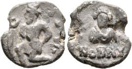 Nonnos, late 5th-6th century. Seal (Lead, 17 mm, 2.91 g, 12 h). Captive kneeling to left, hands bound behind his back; to left, uncertain object. Rev....