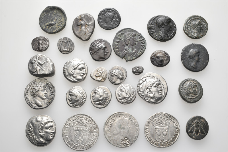 A lot containing 27 silver and bronze coins. Including: Greek, Roman Provincial,...