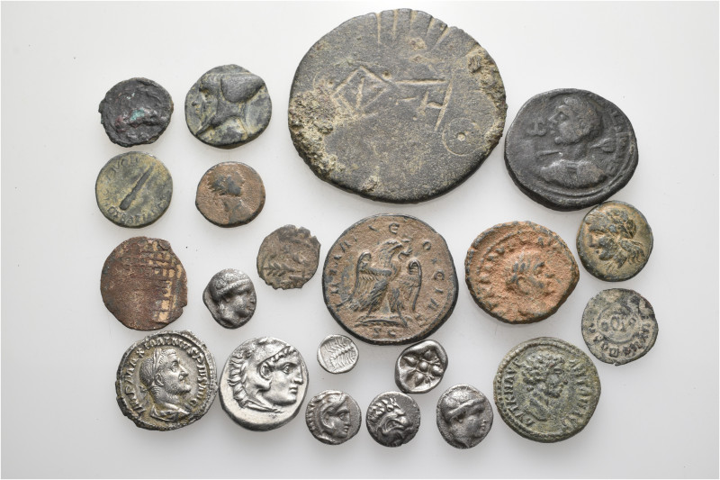 A lot containing 21 silver and bronze coins. Including: Greek, Roman Provincial,...