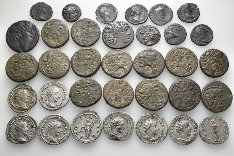 A lot containing 34 silver and bronze coins. Including: Greek and Roman Imperial...