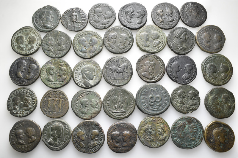 A lot containing 34 bronze coins. All: Roman Provincial. Fine to good very fine....