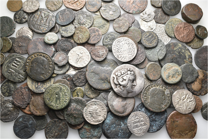 A lot containing 121 silver and bronze coins. Including: Greek, Roman Provincial...