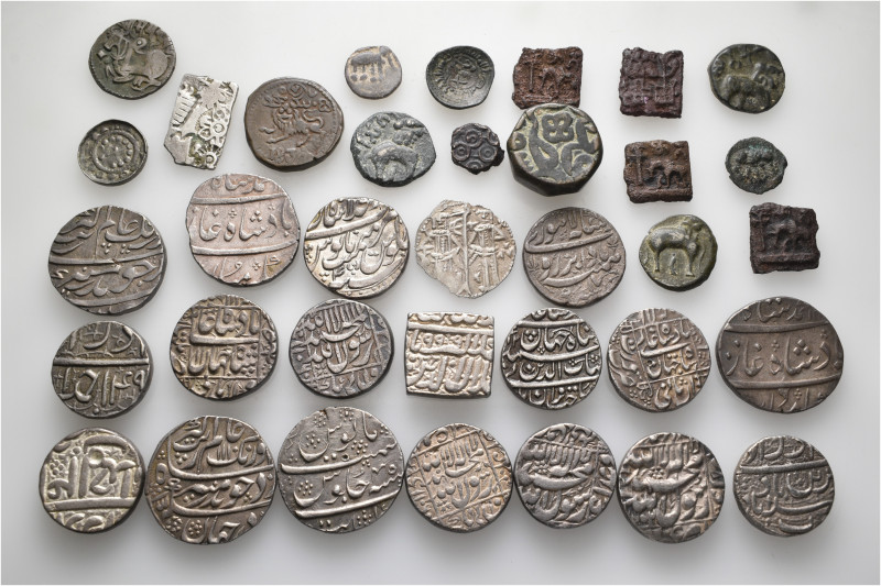 A lot containing 35 silver and bronze coins. Mainly: India. Very fine to extreme...