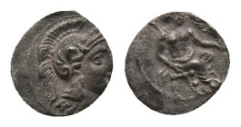 CILICIA. Uncertain. Obol. (4th century BC). AR Silver Obv: Helmeted head of Athena right. Rev: Baaltars seated right on throne, holding eagle and lotu...