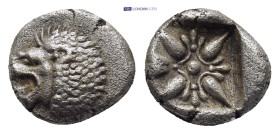 Ionia. Miletos circa 525-475 BC. Diobol AR (9mm, 1,0 g) Forepart of lion to right, his head turned back to left / Star-shaped floral ornament within i...