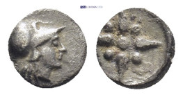 Asia Minor, uncertain or Troas, Kolone. AR, Tetartemorion (6mm, 0.2 g). Circa 500-400 BC. Obv.: Helmeted head of Athena right. Rev.: Star of four rays...