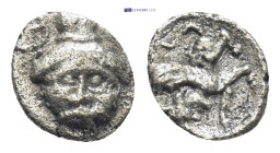 ASIA MINOR, Uncertain. 5th century BC. AR Hemiobol(?) (7mm, 0.3 g). Bearded head facing, wearing kalathos; Aramaic letters(?) to upper left / Sphinx s...