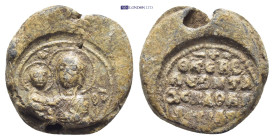 Byzantine Lead Seal (19mm, 9.1 gr) Obv: Nimbate and draped half length bust of the Virgin Mary, facing slightly to left, presenting the youthful Chris...