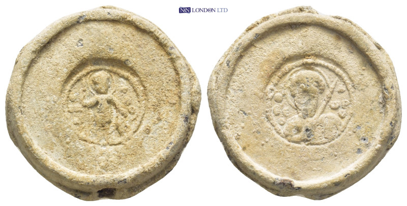 Byzantine Lead Seal (22mm, 14.56 gr) Obv: Saint, standing facing, nimbate, holdi...