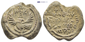 Byzantine Lead Seal (27mm, 18.5 gr) Obv: Eagle with uplifted wings and head turned to left. In field above head of eagle, cruciform invocative monogra...