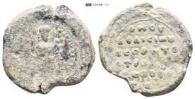 Byzantine Lead Seal (32mm, 18 gr) Obv: St. George standing, balancing his spear and shield against the ground. Rev: Inscription of six lines.