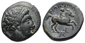 Kings of Macedon, Philip II. Ae,6.35 g 18.75 mm. 359-336 BC. Uncertain mint.
Obv:Diademed head of Apollo right 
Rev: ΦIΛIΠΠOY, Horseman right; below, ...