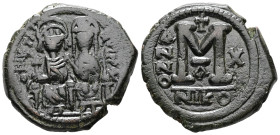 Justin II and Sophia. AD 565-578. AE, Follis. 14.33 g. 30.88 mm. Nicomedia. Dated RY 10 (574/75).
Obv: DNIVSTI-NVSP[PAVC]. Justin II on left and Sophi...