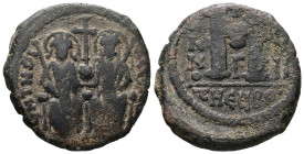 Justin II and Sophia. AD 565-578. AE, Follis. 14.19 g. 29.28 mm. Theoupolis (Antioch).
Obv: [DNIVSTI-NVSPPAVC]. Justin left and Sophia right, seated f...