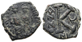 Justin II and Sophia, AD 565-578. AE, Half Follis. 6.85 g. 21.64 mm. Nicomedia.
Obv: DNIVSTI-NVSPPAV. Justin II on left and Sophia on right, seated, n...