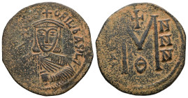 Theophilus, AD 829-842. AE, Follis. 8.07 g. 28.11 mm. Constantinople.
Obv: ✷ΘE-OFILbASIL. Crowned, three-quarter length figure of Theophilus facing, w...