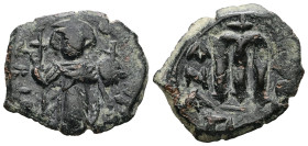 Islamic. Arab-Byzantine, Umayyad Caliphate. Pseudo-Byzantine type, imitating the types of Constans Ii, AD 640-650. AE, Fals. 4.14 g. 22.60 mm. 
Obv: E...