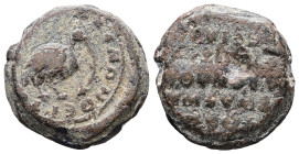 PB Byzantine iconographic seal (AD 10th–11th centuries)
Obv.: A bird facing right, holding a vine or tendril in its beak. Border of dots.
Rev.: Inscri...