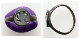 AE Greco-Roman finger ring (AD 1st – 3rd centuries)
Bronze finger ring; tear-drop shaped bezel with engraved design: two dolphins.
Weight: 3.17 g.
Dia...