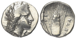 Lukanien. Metapont.

 Nomos (Silber). Ca. 330 - 290 v. Chr.
Vs: Kopf der Demeter mit Ährenkranz rechts.
Rs: Getreideähre, Pflug auf linkem Blatt; ...