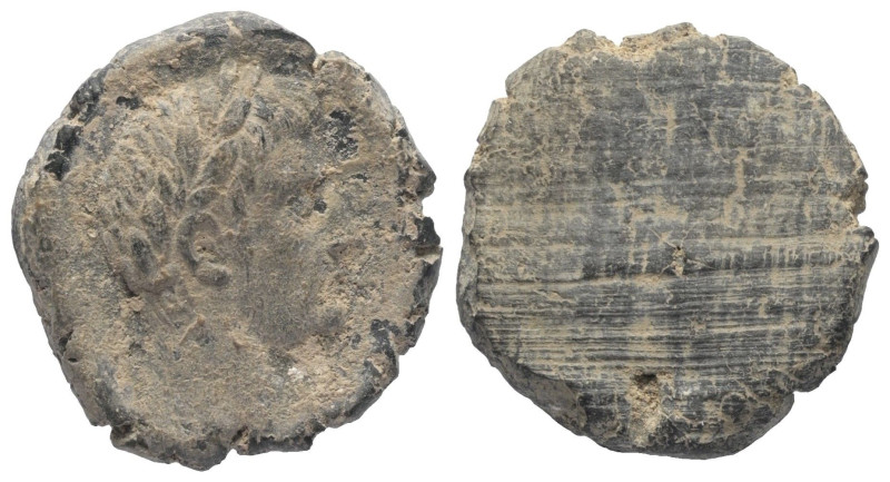 Tesserae. Römische Kaiserzeit.

 Tontessera. 1. Jhdt. n. Chr.
Vs: Kopf des Ka...