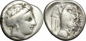 Continental Greece. Euboia, Chalkis. AR Drachm, 290-270 BC. D/ Female head right. R/ Eagle flying upwards, head right, carrying serpent in beak and ta...