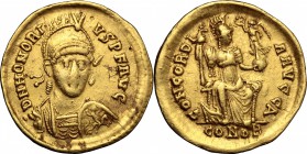 Honorius (393-423). AV Solidus, Constantinople mint, 397-402. D/ Bust of Honorius frontal, helmeted, cuirassed, holding spear behind head and shield. ...