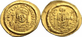 Justinian I (527-565). AV Solidus, Constantinople mint, 542-552. D/ Bust of Justinian facing, helmeted, cuirassed, holding globus cruciger and shield....