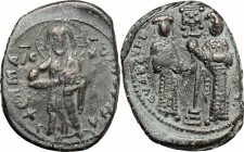 Constantine X Ducas (1059-1067). AE Follis, Constantinople mint, 1059-1067. D/ Christ standing facing on footstool, cross-nimbate, holding book. R/ Eu...