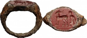 Iron ring with jasper intaglio engraved with bucolic scene (shepherd milking goat). Roman period, 1st-2nd century AD. Gem 14 x 12 mm. Ring size 16 mm.