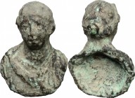 Bronze applique in the shape of female bust. Roman period, 1st-3rd century AD. 41 x 29 mm.