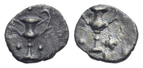 CALABRIA. Tarentum. Circa 280-228 BC. Obol (Silver, 9.35 mm, 0.45 g). Kantharos; pellets to left and right. Rev. Kantharos; pellet to left, grapes to ...