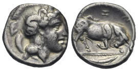 LUCANIA. Thurium, circa 350-300 BC. Nomos (Silver, 20.00 mm, 7.00 g). Head of Athena right, wearing Attic helmet decorated with Scylla. Rev. ΘOΥΡIΩN; ...