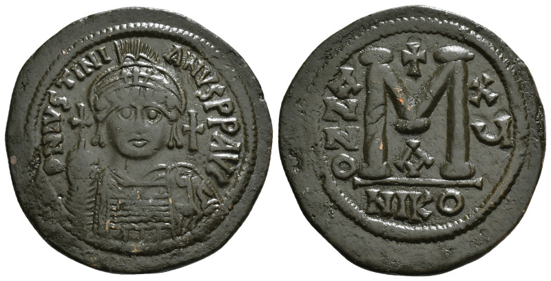 JUSTINIAN I (527-565). Follis. 
Obv: D N IVSTINIANVS P P AVG.
Helmeted and cuira...