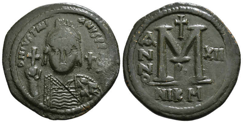 JUSTINIAN I (527-565). Follis. 
Obv: D N IVSTINIANVS P P AVG.
Helmeted and cuira...