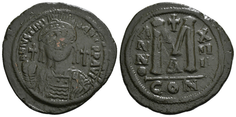 JUSTINIAN I (527-565). Follis.
Obv: D N IVSTINIANVS P P AVG.
Helmeted and cuiras...