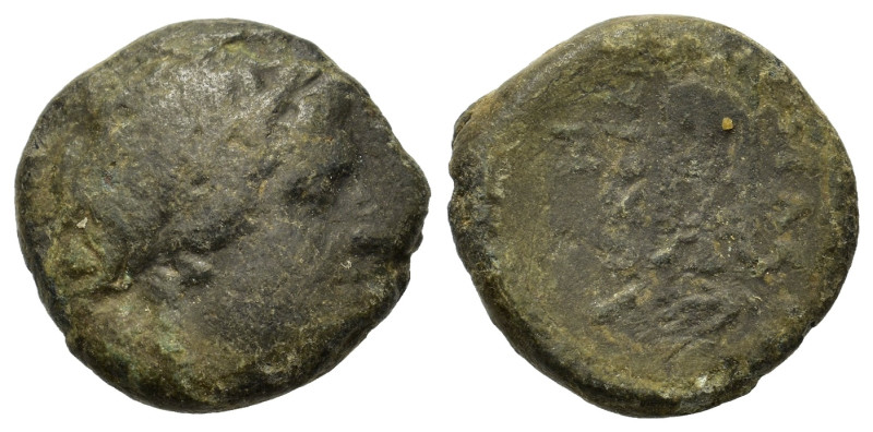 Uncertain Greek. Æ (15mm, 3.8g). Laureate head of Apollo r. R/ Uncertain.