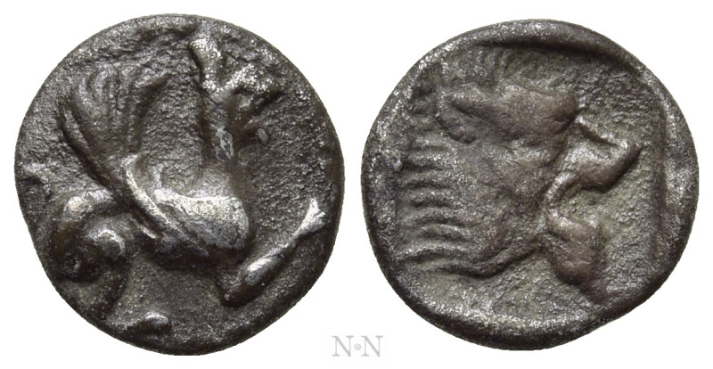 TROAS. Assos. Obol (5th century BC). 

Obv: Griffin seated right.
Rev: Lion's...