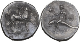 Greek Italy. Southern Apulia, Tarentum. AR Nomos, c. 280-272 BC. Obv. Nude youth on horseback right, placing wreath on horse's head; ZΩ to left, NEY/M...