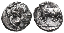 Southern Lucania, Thourioi, c. 400-350 BC. AR Triobol (10mm, 1.06g). Helmeted head of Athena r., helmet decorated with Skylla holding trident. R/ Bull...