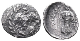 Sicily, Kamarina, c. 461-440/35 BC. AR Litra (11mm, 0.60g). Nike flying l.; below, swan standing l.; all within wreath. R/ Athena standing l., holding...