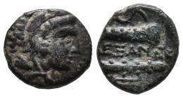 Kings of Macedon, Alexander III 'the Great' (336-323 BC). Æ 1/4 Unit (9mm, 1.25g). Head of Herakles r., wearing lion skin. R/ Bow in bow-case and club...