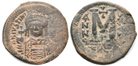 Justinian I (527-565). Æ 40 Nummi (30mm, 18.33g). Theoupolis (Antioch), uncertain year. Helmeted and cuirassed bust facing, holding globus cruciger an...
